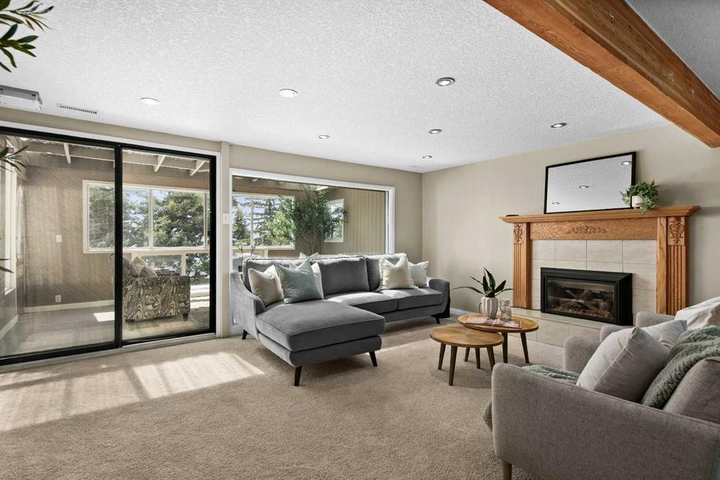 7715 67 Avenue Nw, Calgary, AB - Indoor Photo Showing Living Room With Fireplace