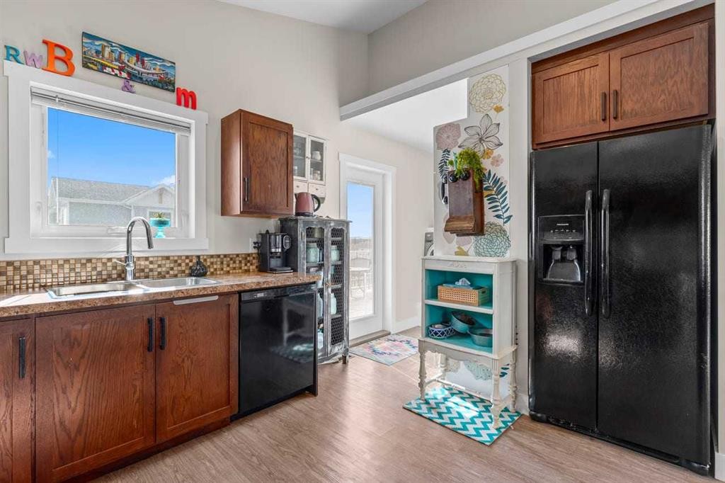 317 Mcleod Crescent, Diamond Valley, AB - Indoor Photo Showing Kitchen With Double Sink