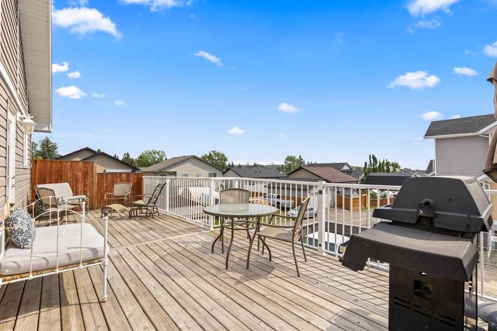 317 Mcleod Crescent, Diamond Valley, AB - Outdoor With Deck Patio Veranda With Exterior