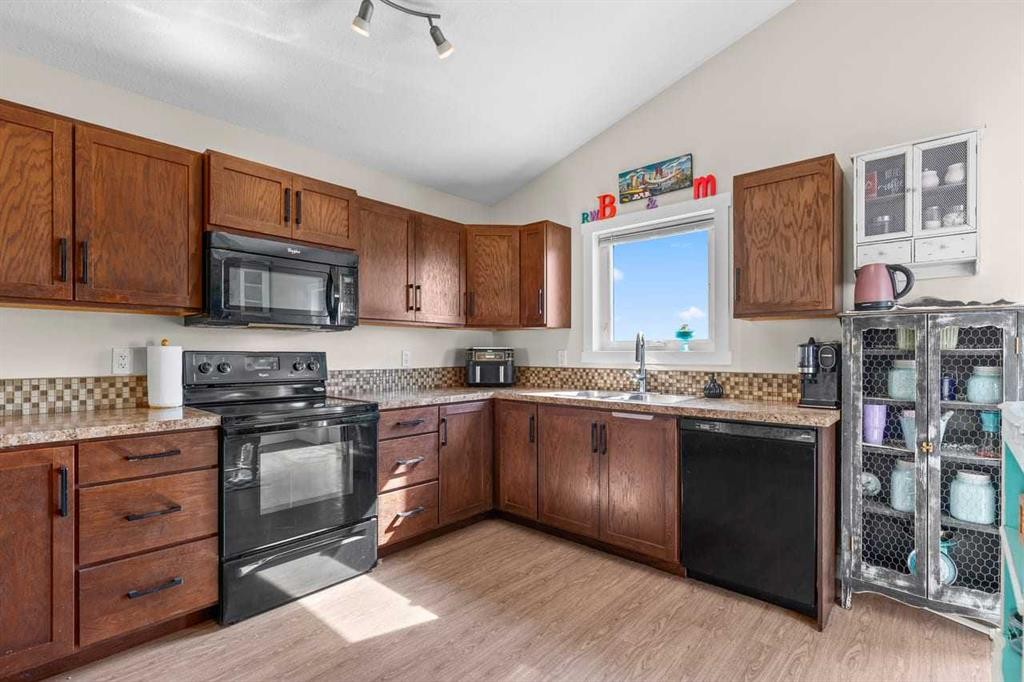 317 Mcleod Crescent, Diamond Valley, AB - Indoor Photo Showing Kitchen With Double Sink