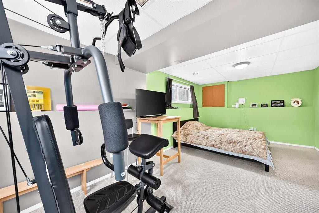 96 Covington Court Ne, Calgary, AB - Indoor Photo Showing Gym Room