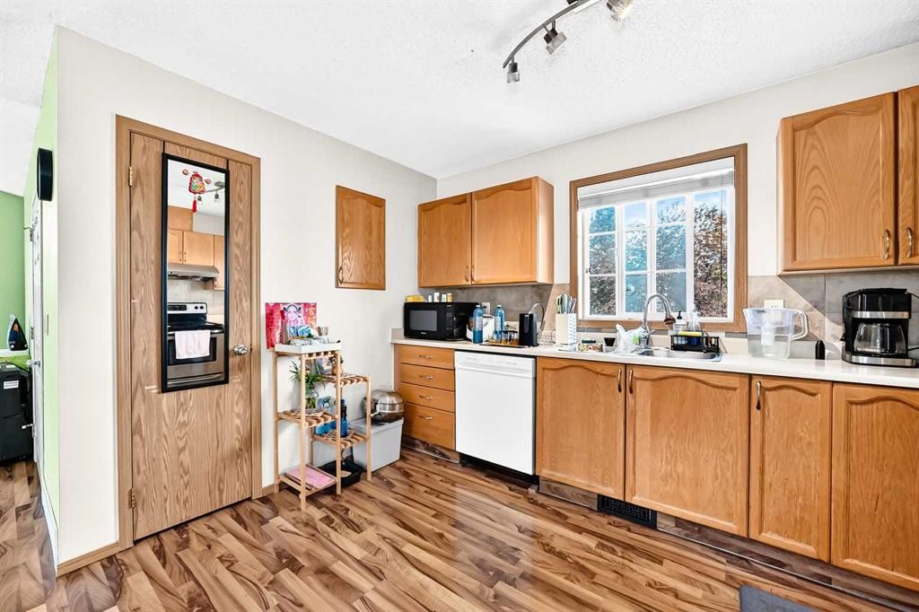 96 Covington Court Ne, Calgary, AB - Indoor Photo Showing Kitchen With Double Sink