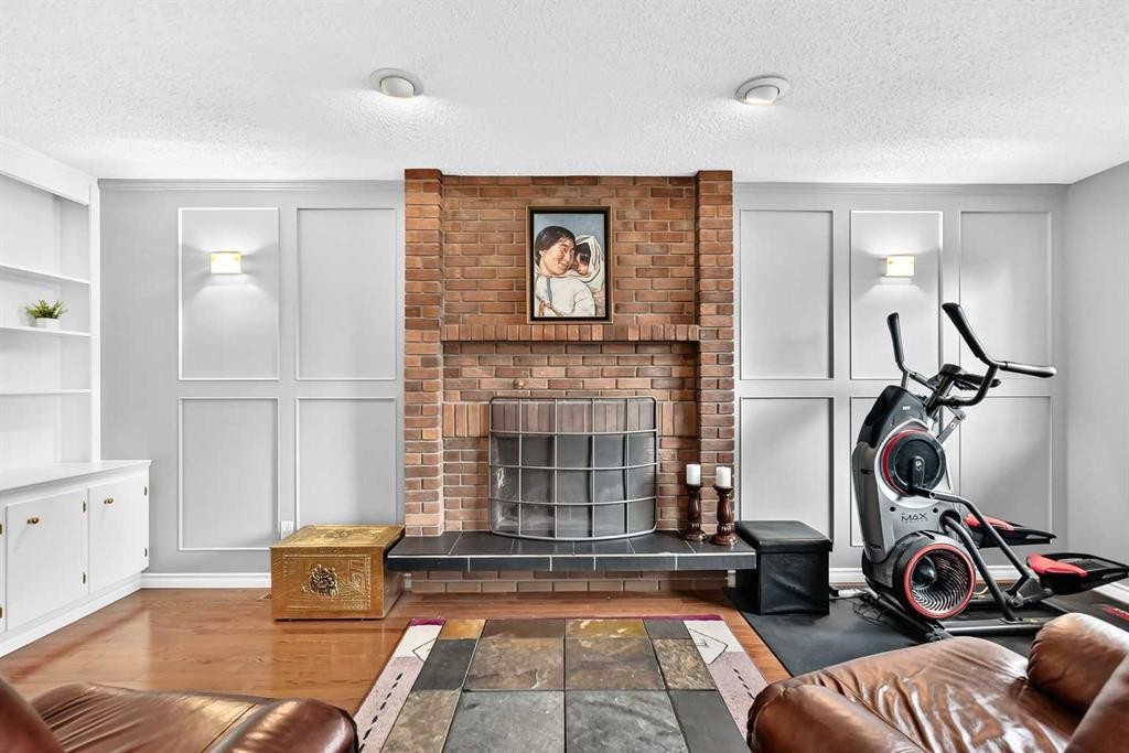 43 Brabourne Mews Sw, Calgary, AB - Indoor With Fireplace
