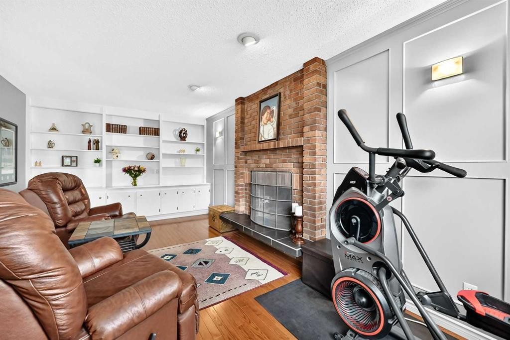 43 Brabourne Mews Sw, Calgary, AB - Indoor With Fireplace