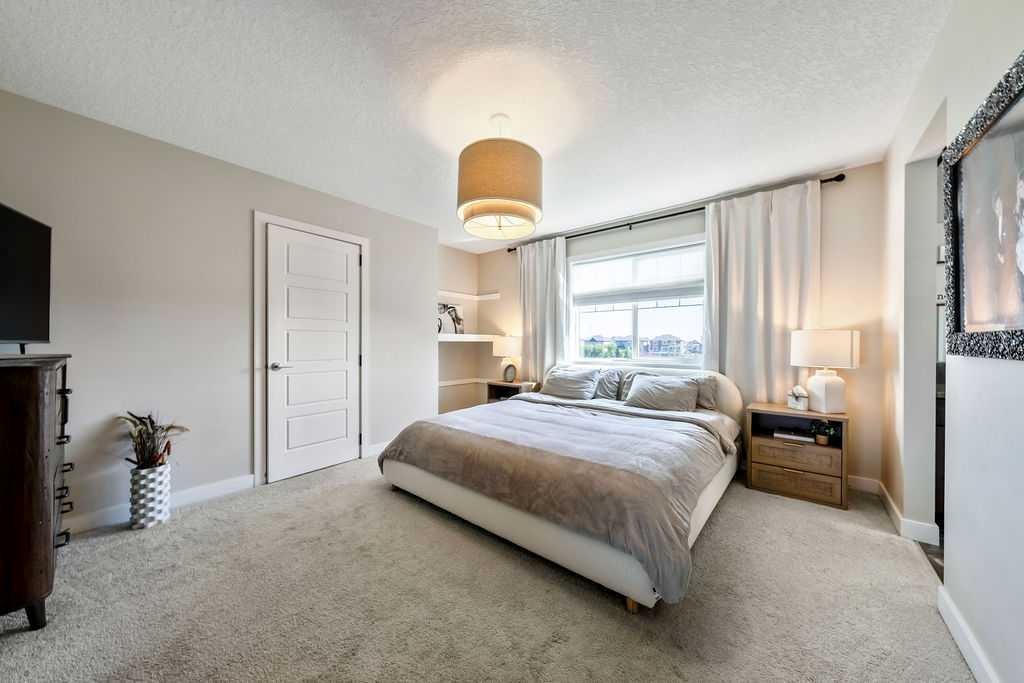 148 Rainbow Falls Glen, Chestermere, AB - Indoor Photo Showing Bedroom