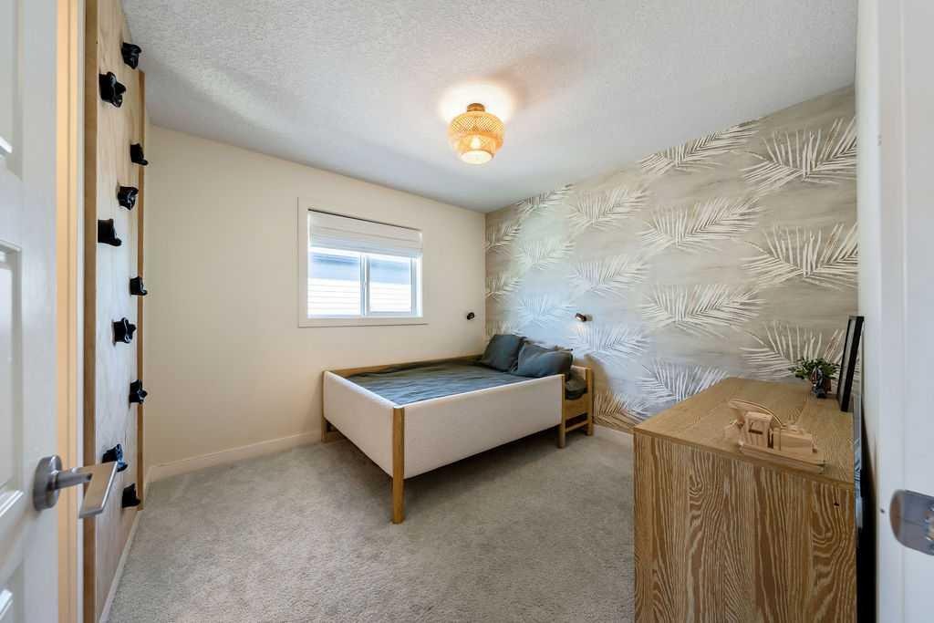 148 Rainbow Falls Glen, Chestermere, AB - Indoor Photo Showing Bedroom