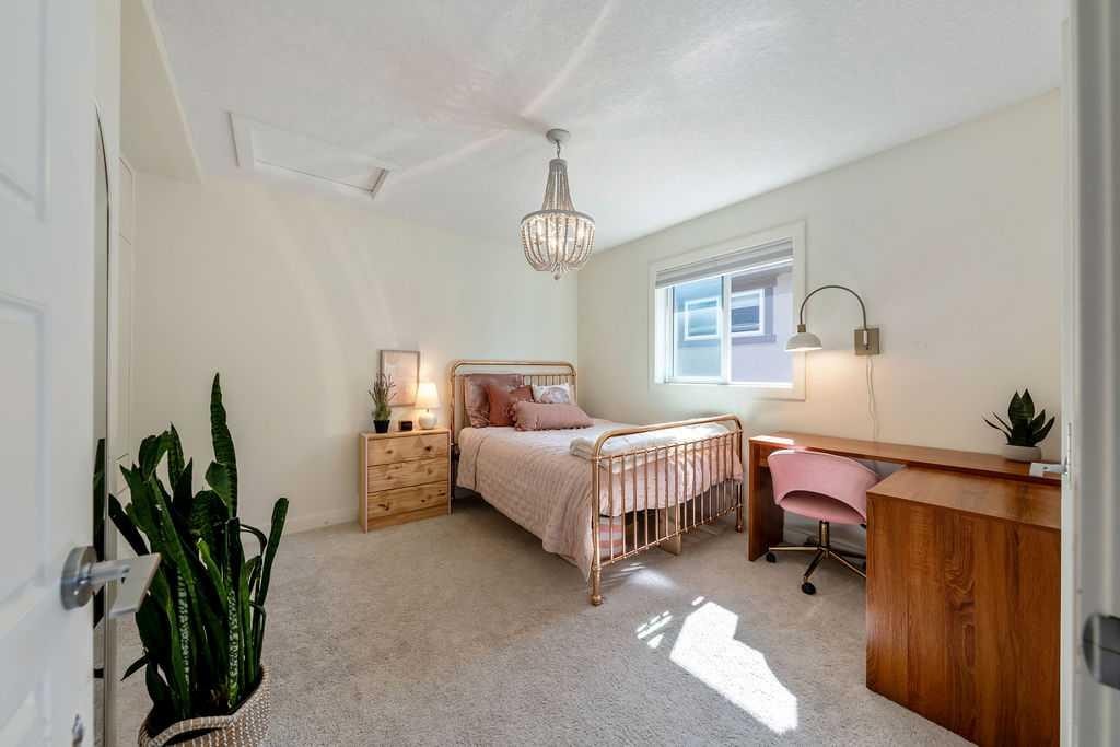 148 Rainbow Falls Glen, Chestermere, AB - Indoor Photo Showing Bedroom
