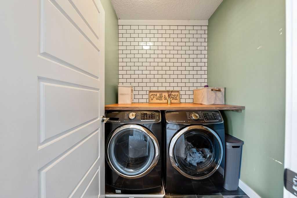148 Rainbow Falls Glen, Chestermere, AB - Indoor Photo Showing Laundry Room
