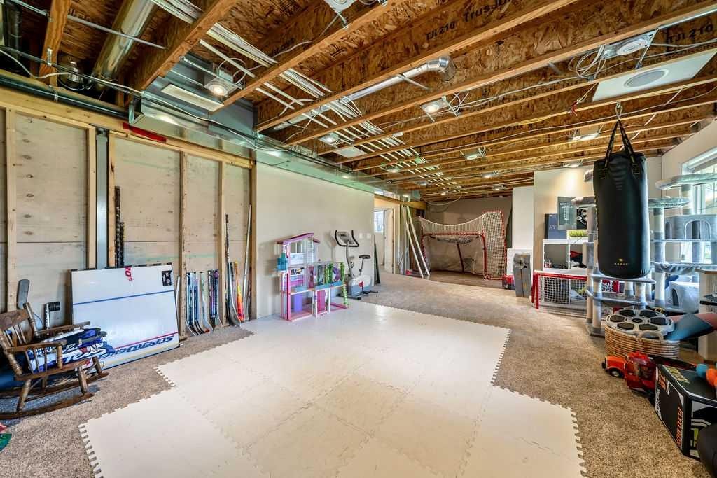 148 Rainbow Falls Glen, Chestermere, AB - Indoor Photo Showing Basement