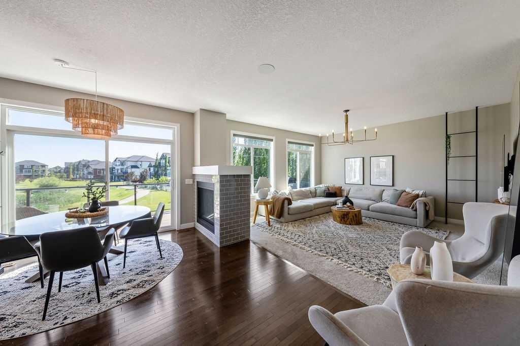 148 Rainbow Falls Glen, Chestermere, AB - Indoor Photo Showing Living Room With Fireplace