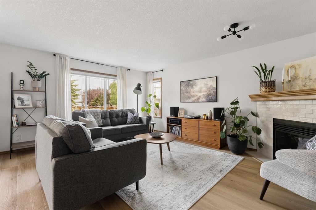 36 Cranfield Manor Se, Calgary, AB - Indoor Photo Showing Living Room With Fireplace