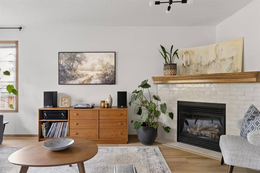 36 Cranfield Manor Se, Calgary, AB - Indoor Photo Showing Living Room With Fireplace