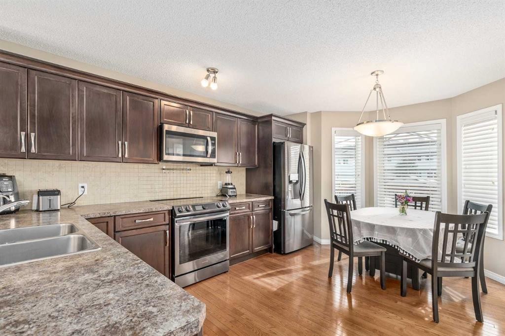 240 Elgin Meadows Gardens Se, Calgary, AB - Indoor Photo Showing Kitchen With Double Sink