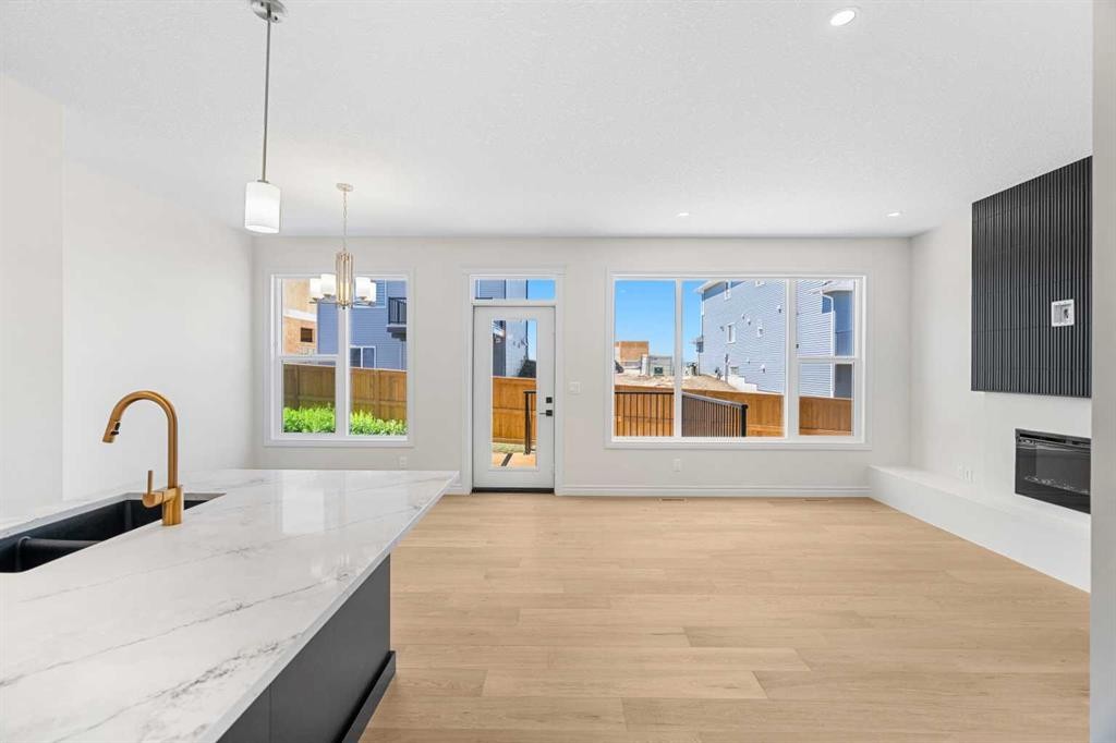 63 Annette Rise Nw, Calgary, AB - Indoor Photo Showing Kitchen With Fireplace With Double Sink