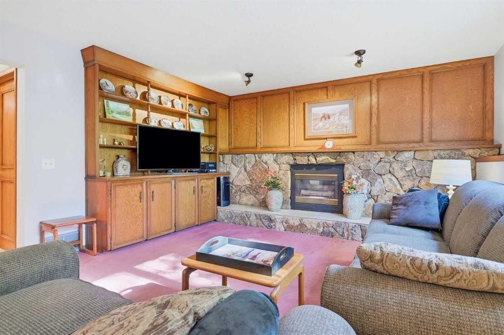 149 Edgehill Drive Nw, Calgary, AB - Indoor Photo Showing Living Room With Fireplace