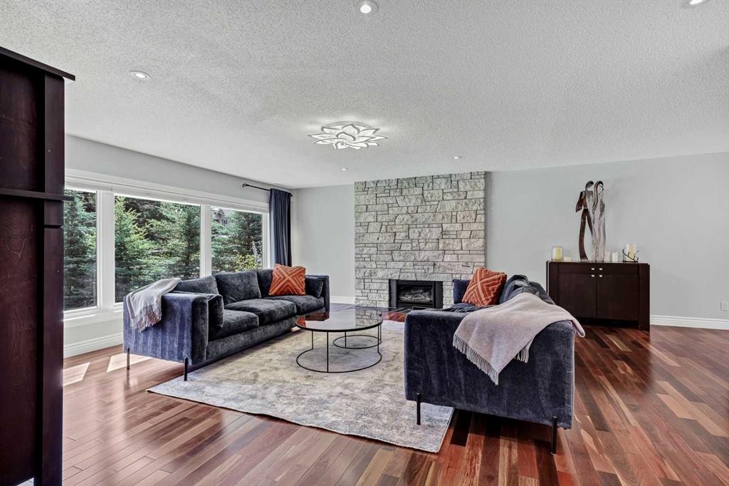 10907 Willowfern Drive Se, Calgary, AB - Indoor Photo Showing Living Room With Fireplace