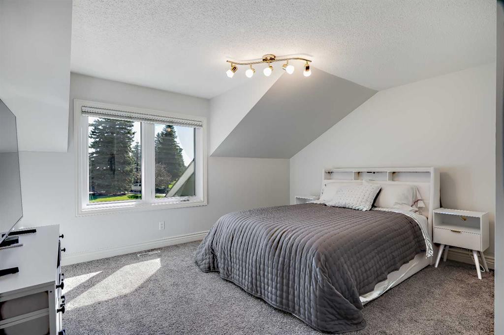 10907 Willowfern Drive Se, Calgary, AB - Indoor Photo Showing Bedroom