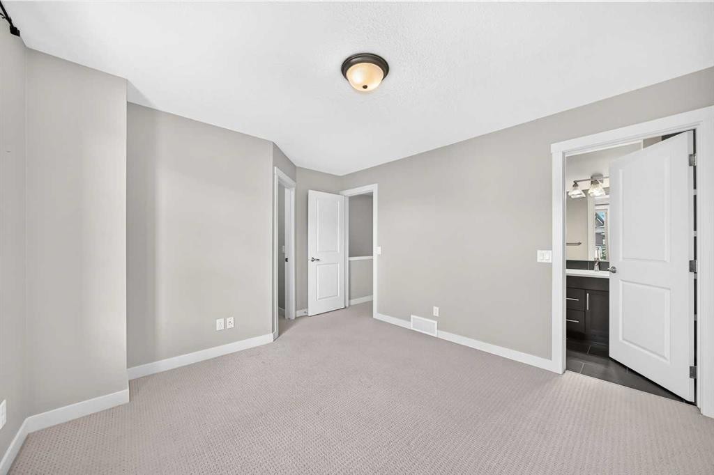 57 Aspen Hills Common Sw, Calgary, AB - Indoor Photo Showing Other Room