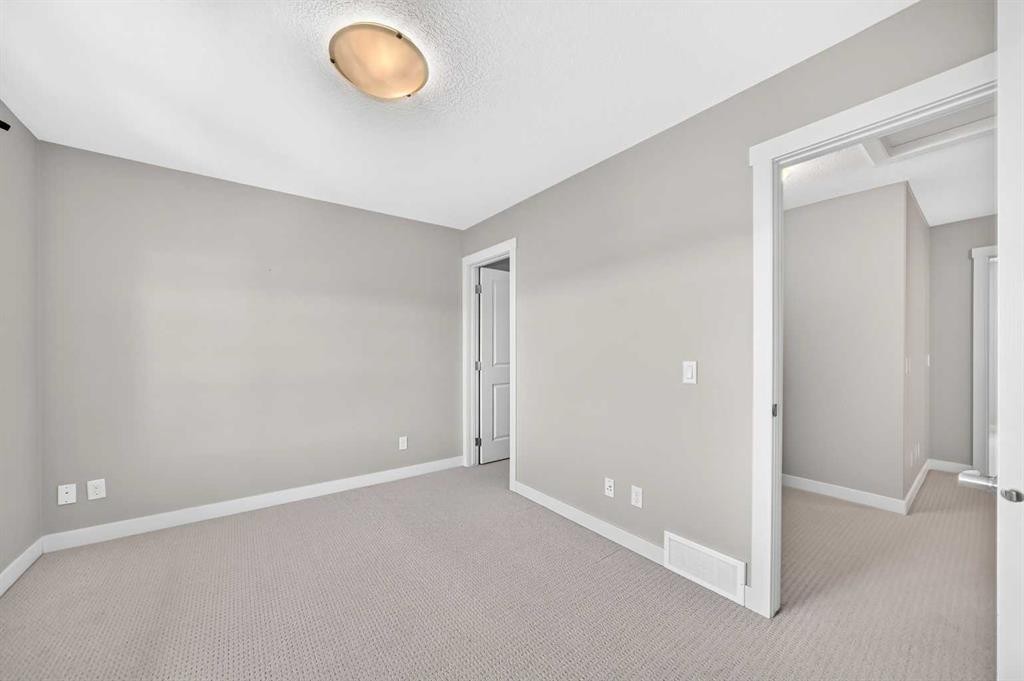 57 Aspen Hills Common Sw, Calgary, AB - Indoor Photo Showing Other Room