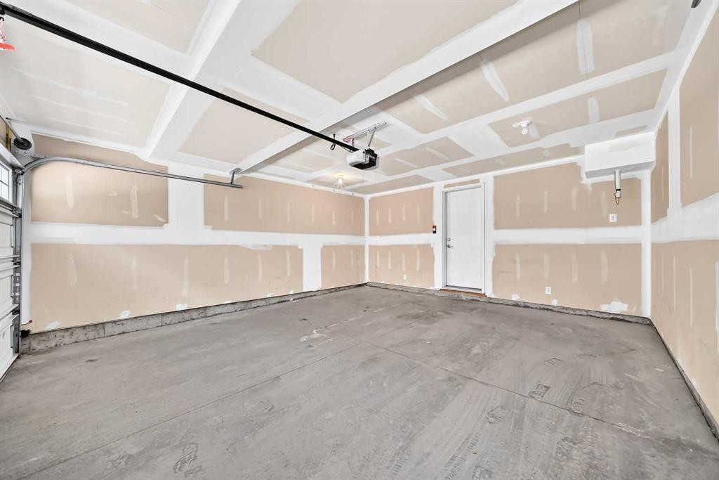 57 Aspen Hills Common Sw, Calgary, AB - Indoor Photo Showing Garage