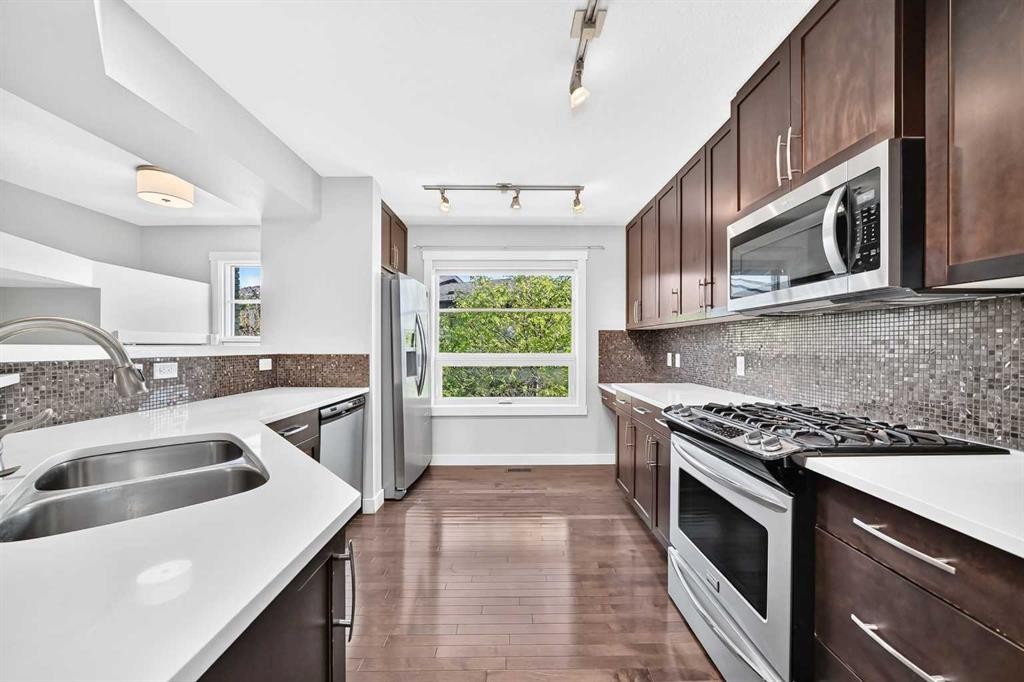 57 Aspen Hills Common Sw, Calgary, AB - Indoor Photo Showing Kitchen With Stainless Steel Kitchen With Double Sink With Upgraded Kitchen
