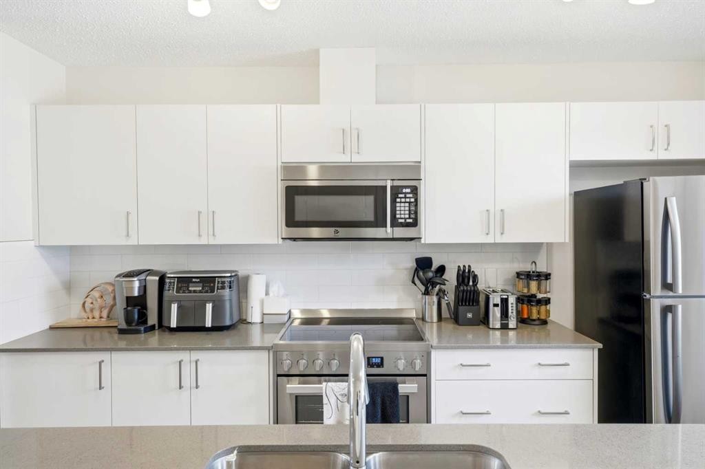 412 Cranbrook Square Se, Calgary, AB - Indoor Photo Showing Kitchen With Stainless Steel Kitchen With Upgraded Kitchen