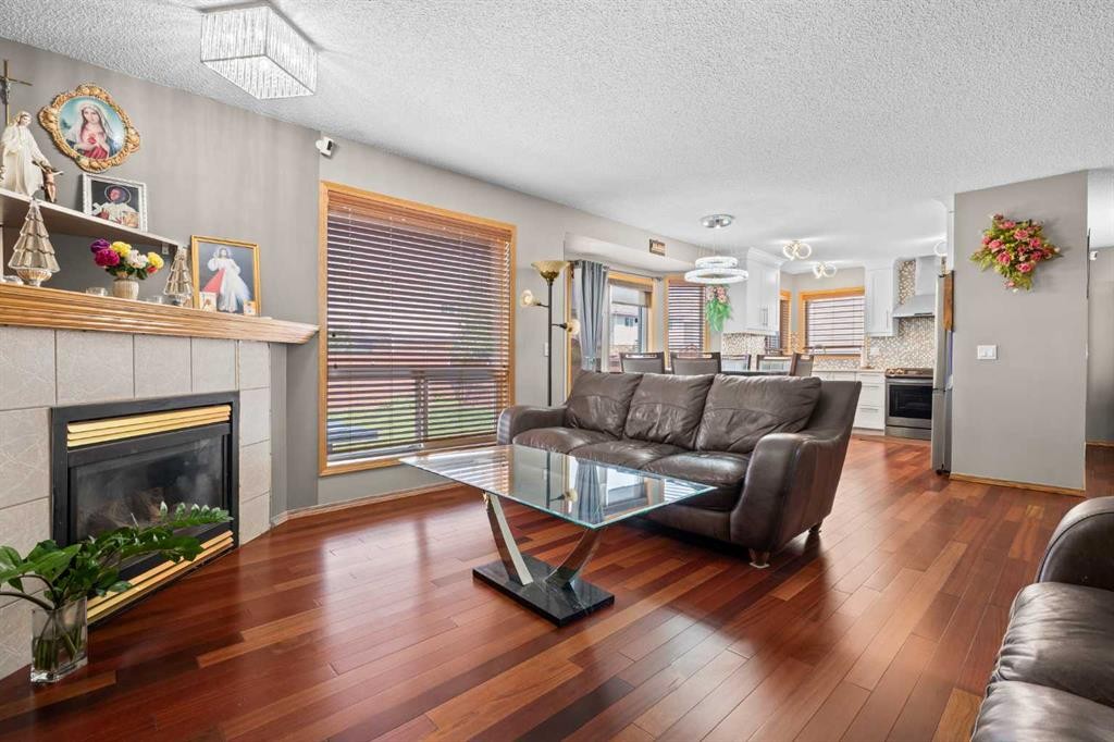 47 Coral Springs Close Ne, Calgary, AB - Indoor Photo Showing Living Room With Fireplace
