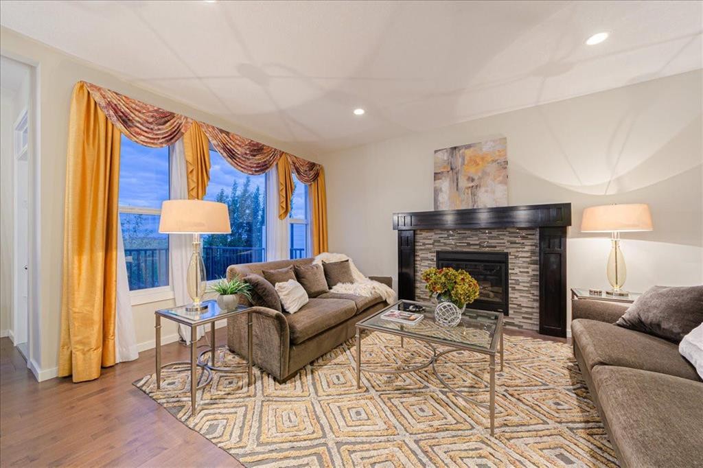 138 Copperpond Street Se, Calgary, AB - Indoor Photo Showing Living Room With Fireplace
