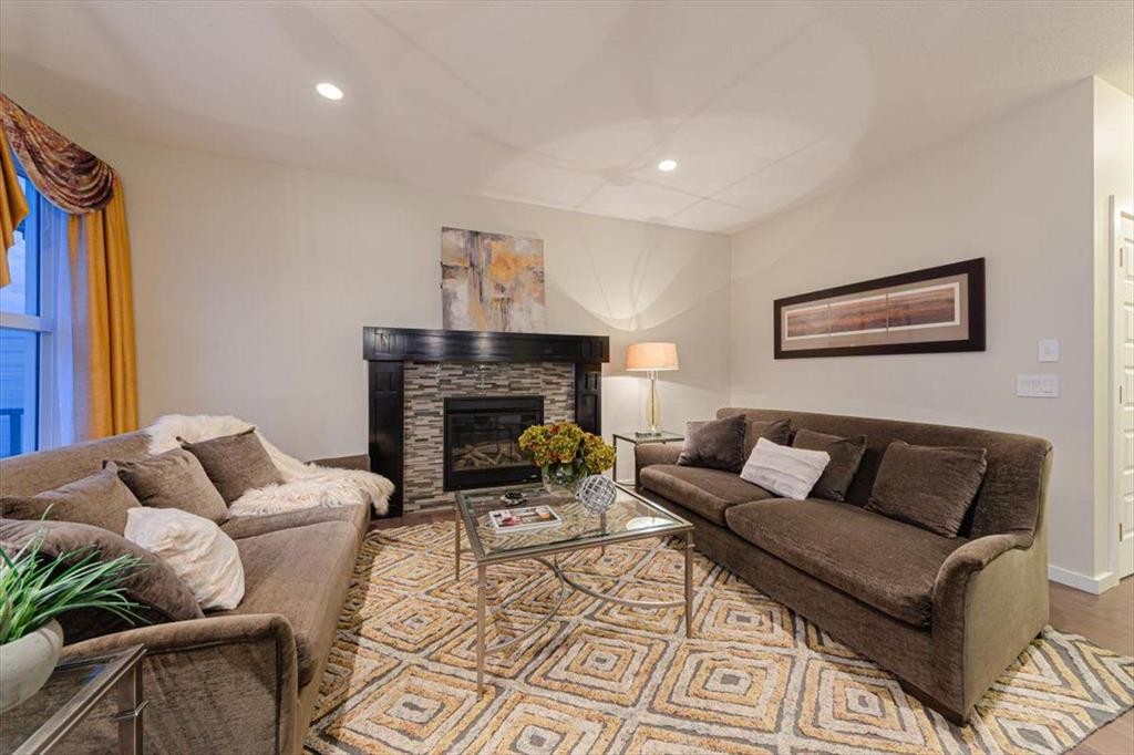 138 Copperpond Street Se, Calgary, AB - Indoor Photo Showing Living Room With Fireplace