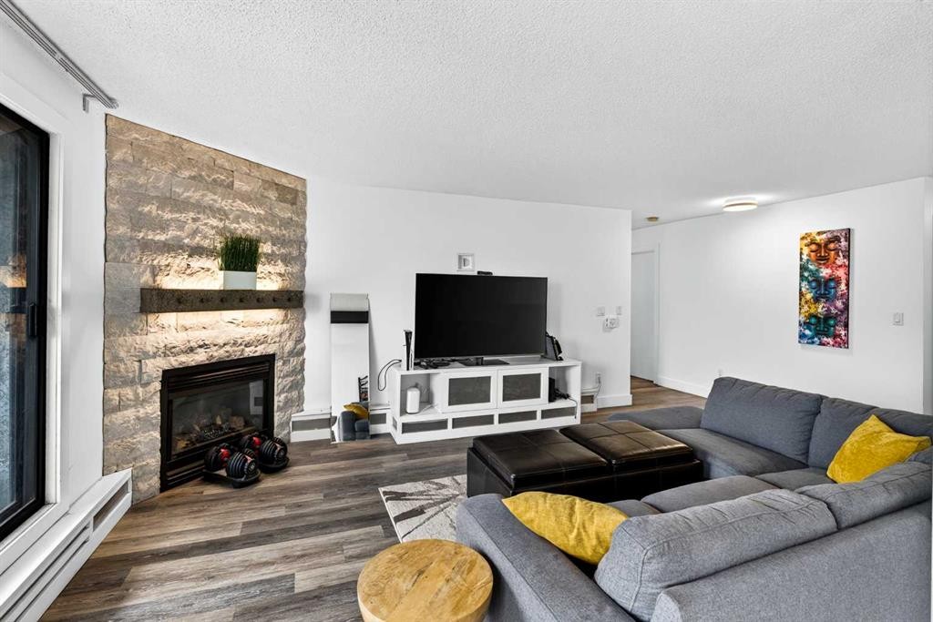 10-635 Marsh Road Ne, Calgary, AB - Indoor Photo Showing Living Room With Fireplace