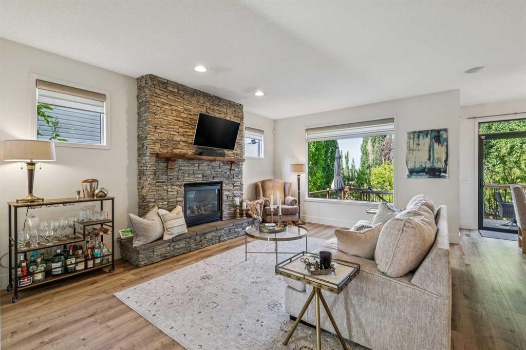 135 Tuscany Ravine Road Nw, Calgary, AB - Indoor Photo Showing Living Room With Fireplace