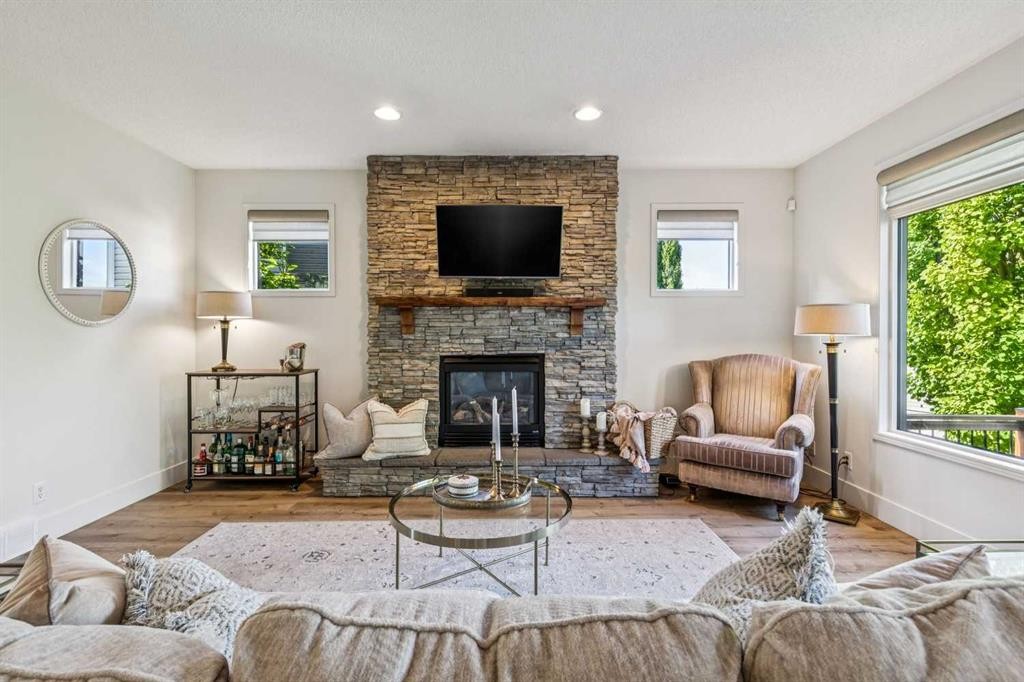 135 Tuscany Ravine Road Nw, Calgary, AB - Indoor Photo Showing Living Room With Fireplace