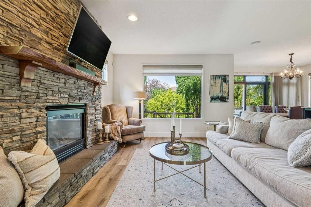 135 Tuscany Ravine Road Nw, Calgary, AB - Indoor Photo Showing Living Room With Fireplace