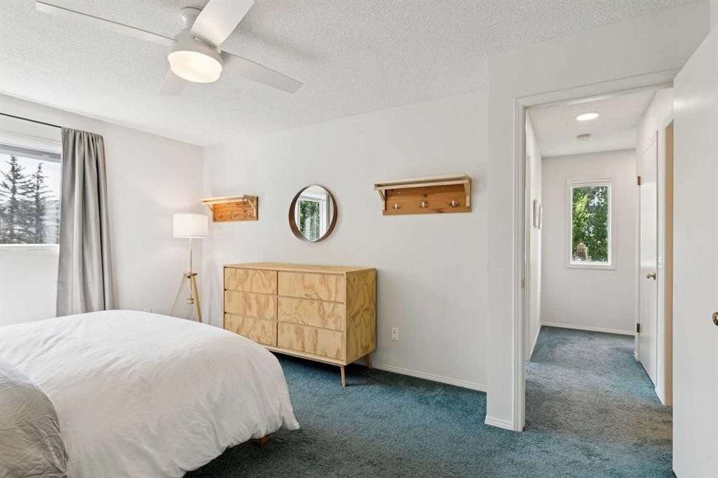98 River Rock Way Se, Calgary, AB - Indoor Photo Showing Bedroom
