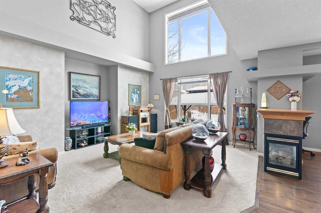 22 Westfall Drive, Okotoks, AB - Indoor Photo Showing Living Room With Fireplace