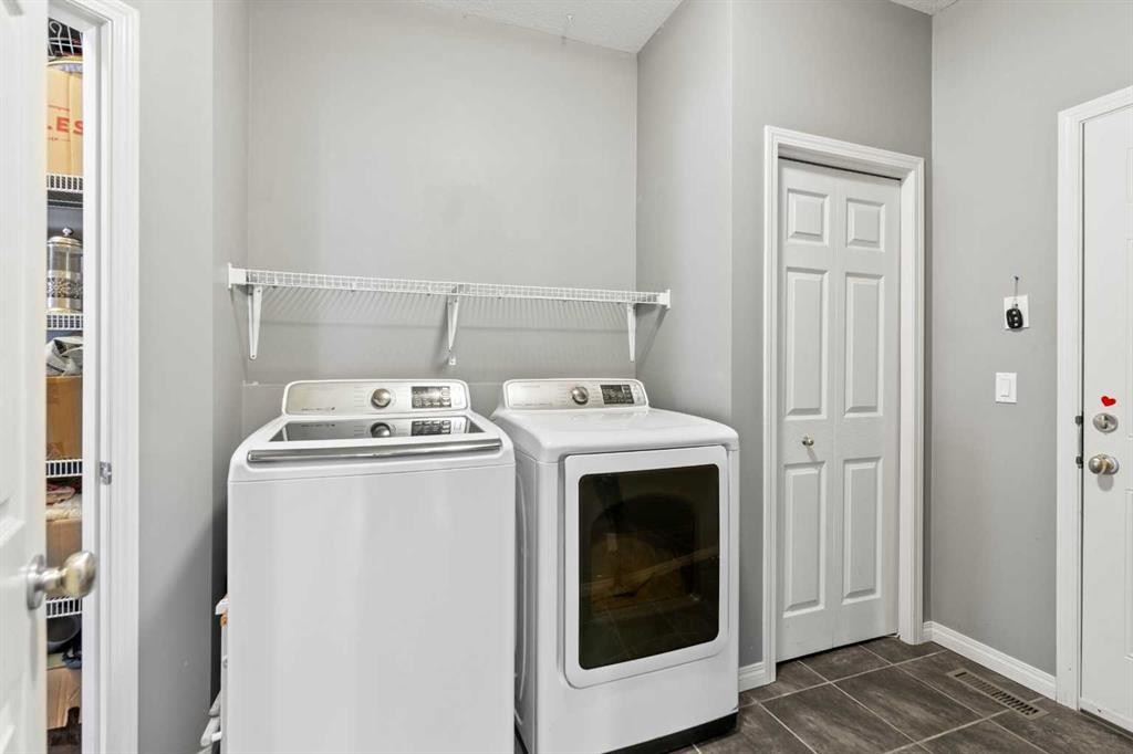 22 Westfall Drive, Okotoks, AB - Indoor Photo Showing Laundry Room