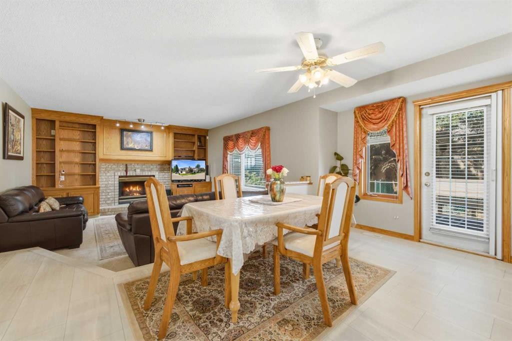 71 Woodpark Close Sw, Calgary, AB - Indoor With Fireplace