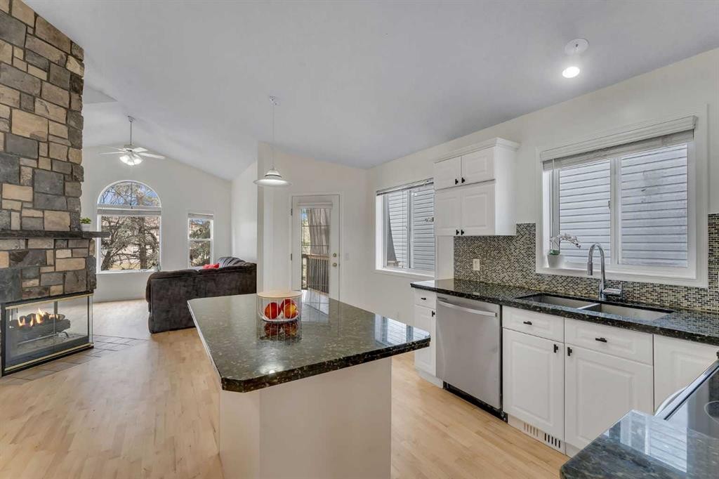 44 Douglas Glen Crescent, Calgary, AB - Indoor Photo Showing Kitchen With Fireplace