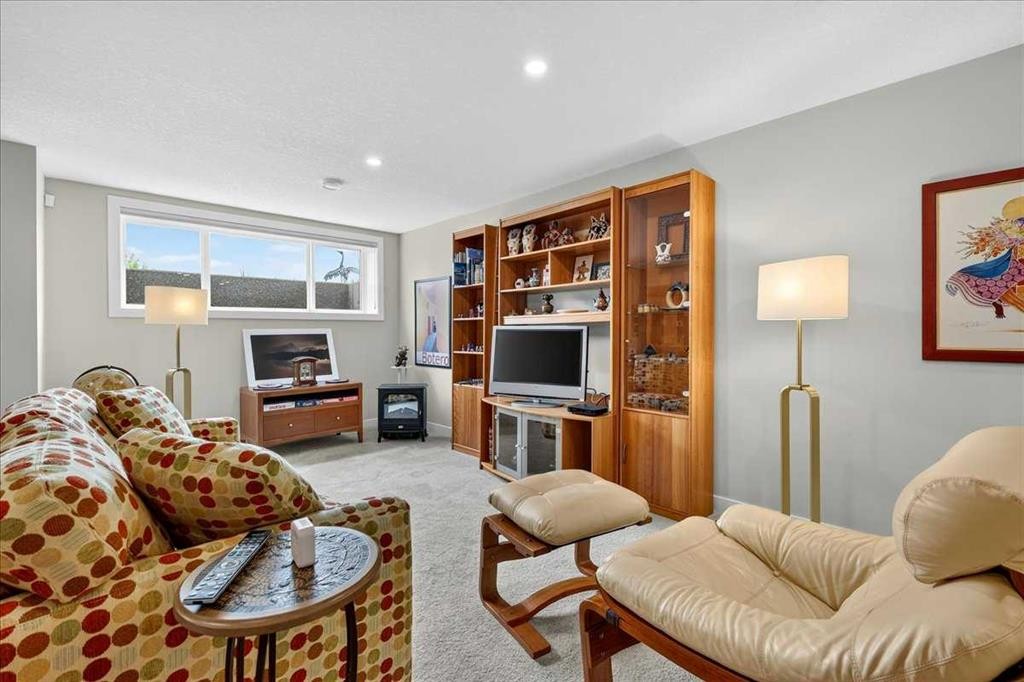 1066 Creekside Boulevard Sw, Calgary, AB - Indoor Photo Showing Living Room