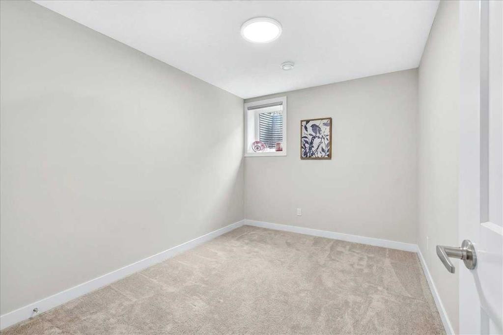 1066 Creekside Boulevard Sw, Calgary, AB - Indoor Photo Showing Other Room