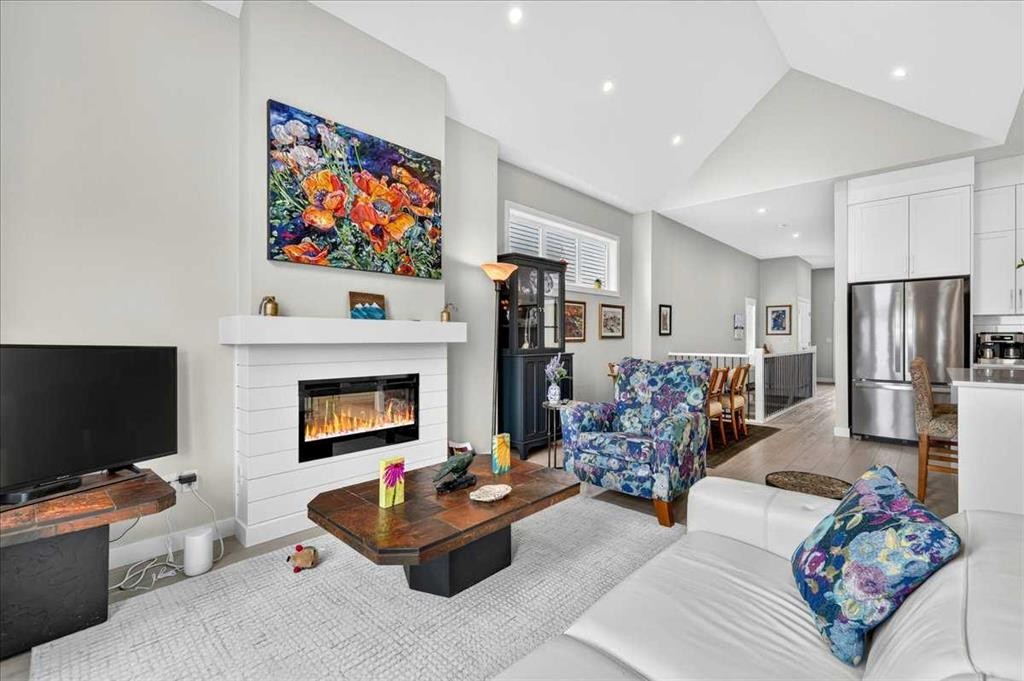 1066 Creekside Boulevard Sw, Calgary, AB - Indoor Photo Showing Living Room With Fireplace