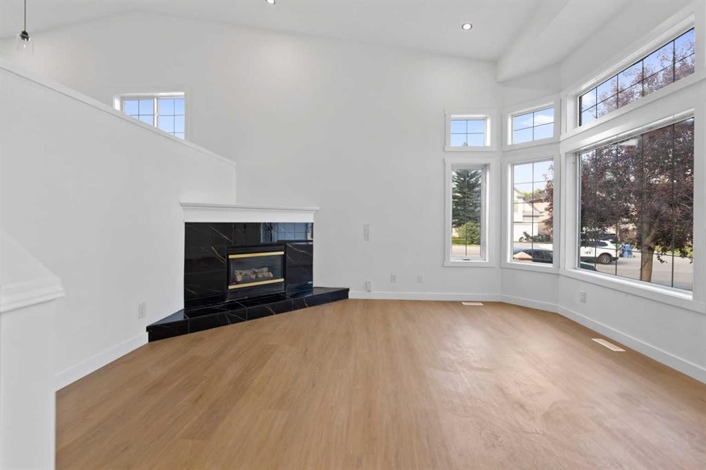 434 Harvest Grove Place Ne, Calgary, AB - Indoor Photo Showing Other Room With Fireplace