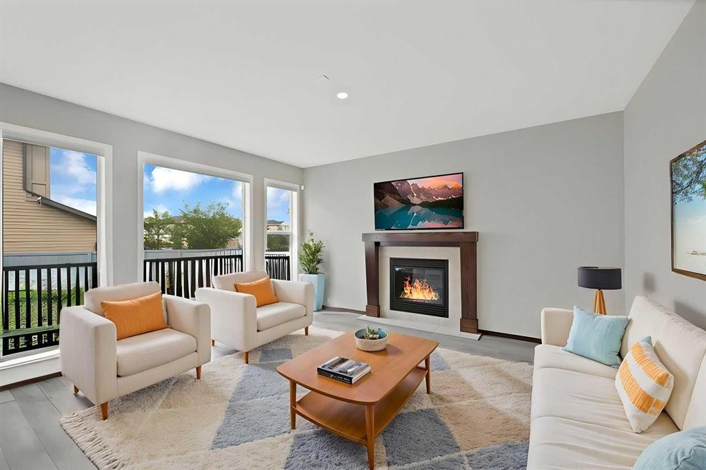 799 New Brighton Drive Se, Calgary, AB - Indoor Photo Showing Living Room With Fireplace