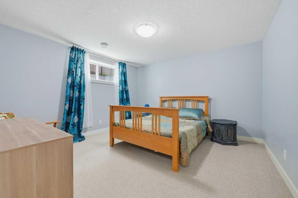 27 Jumping Pound Terrace, Cochrane, AB - Indoor Photo Showing Bedroom