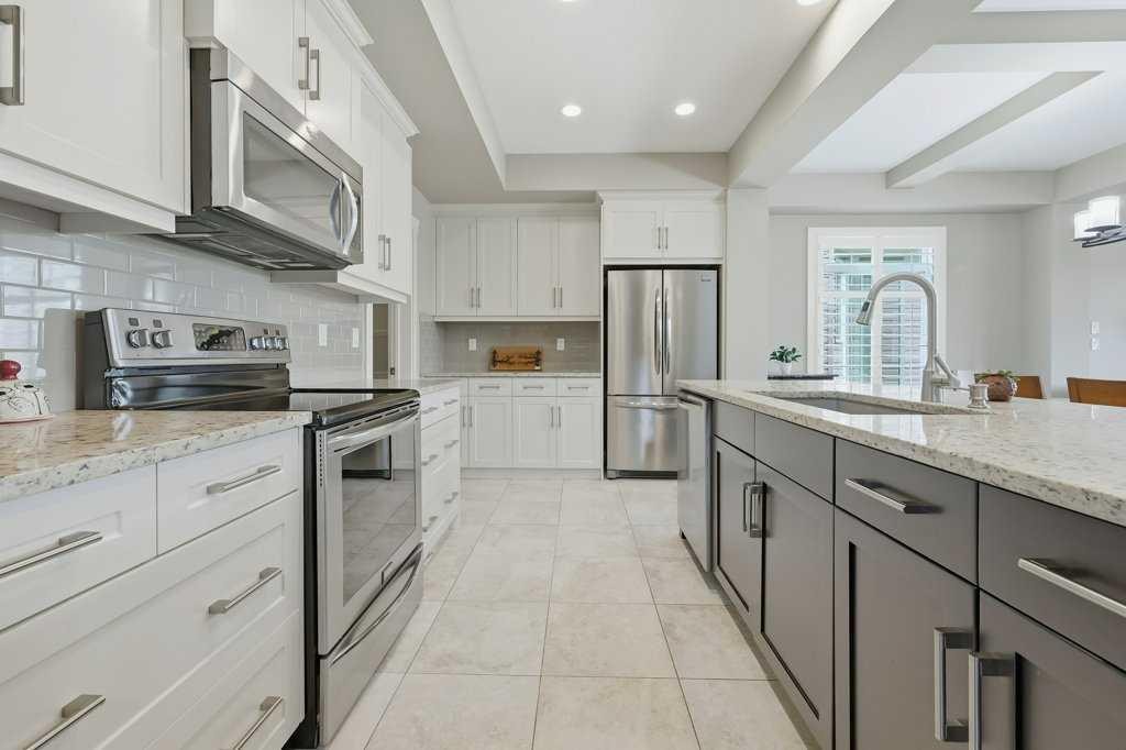 27 Jumping Pound Terrace, Cochrane, AB - Indoor Photo Showing Kitchen With Upgraded Kitchen