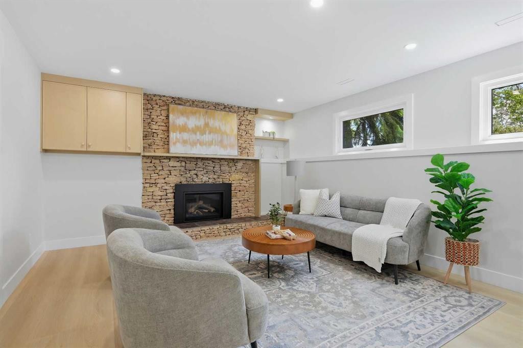 1132 Lake Sylvan Place Se, Calgary, AB - Indoor Photo Showing Living Room With Fireplace