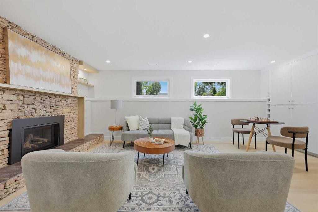 1132 Lake Sylvan Place Se, Calgary, AB - Indoor Photo Showing Living Room With Fireplace