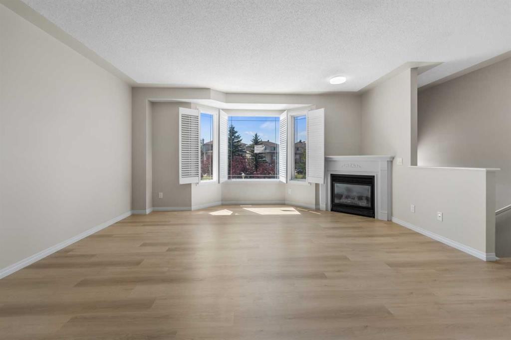 116 Country Hills Gardens Nw, Calgary, AB - Indoor Photo Showing Living Room With Fireplace