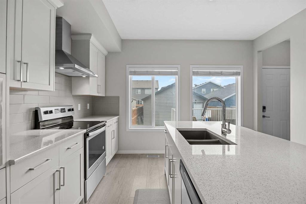 38 Howse Row North, Calgary, AB - Indoor Photo Showing Kitchen With Stainless Steel Kitchen With Double Sink With Upgraded Kitchen