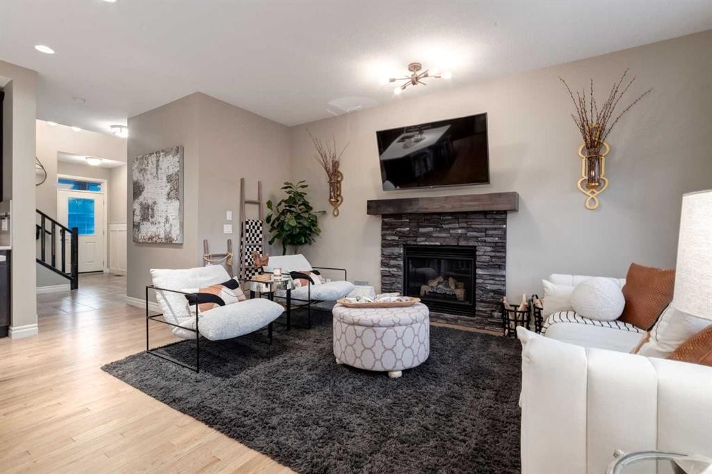444 Evansglen Drive Nw, Calgary, AB - Indoor Photo Showing Living Room With Fireplace